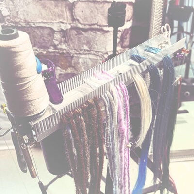 sepia Hair Butler™ hair extension workstation tool has room for tools and can hold many types of extensions including dreadlocks