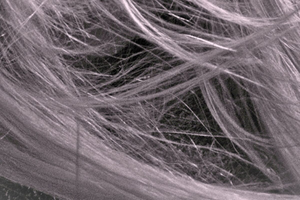 close up of sepia filtered hair Hair Butler™ hair extension workstation tool