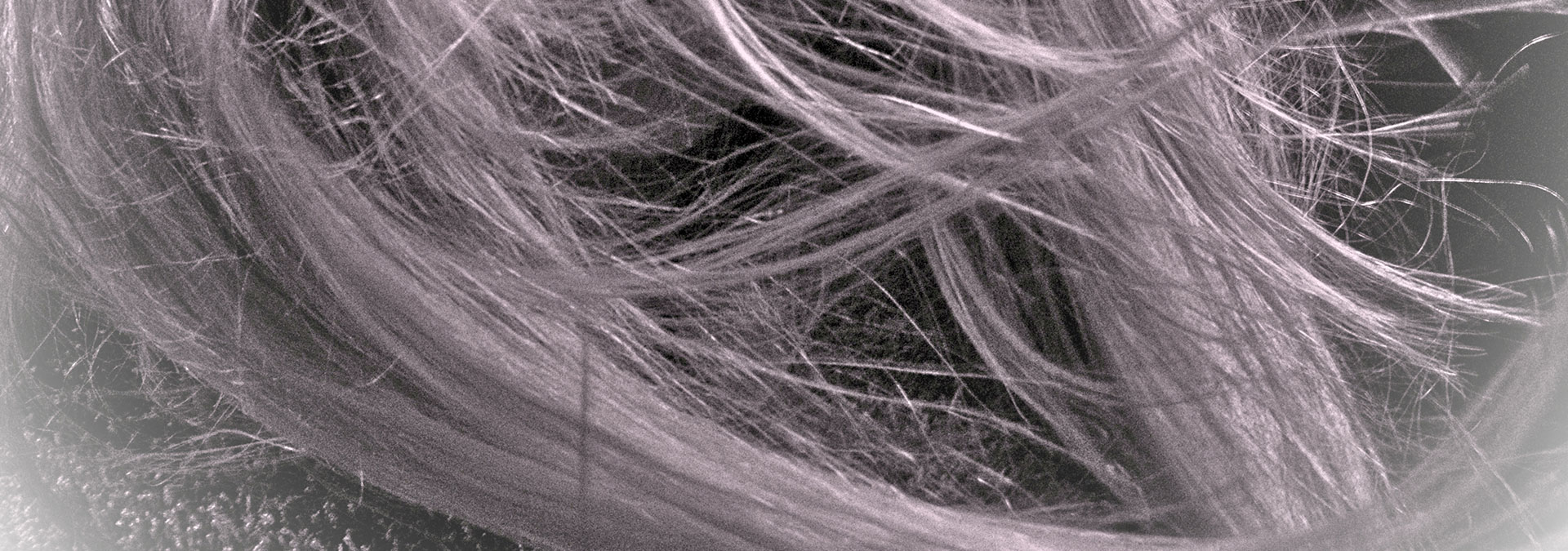 close up of sepia filtered hair Hair Butler™ hair extension workstation tool